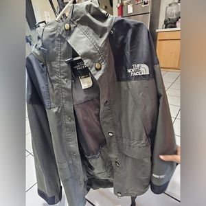 Military with black the north face jacket